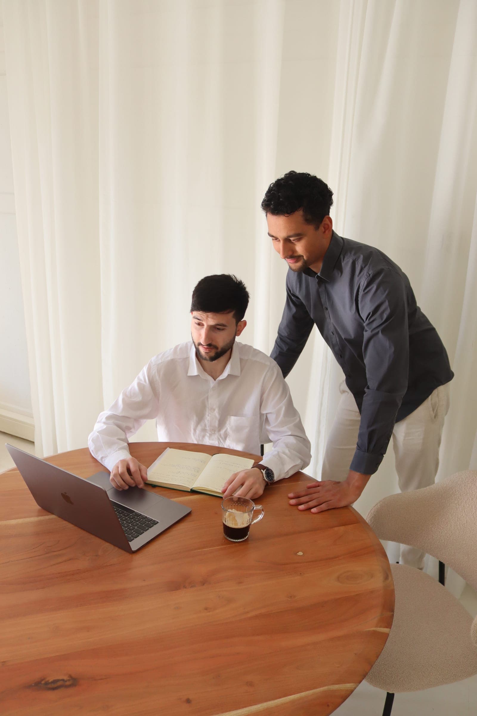 Two colleagues going through the numbers of a Google Ads account together
